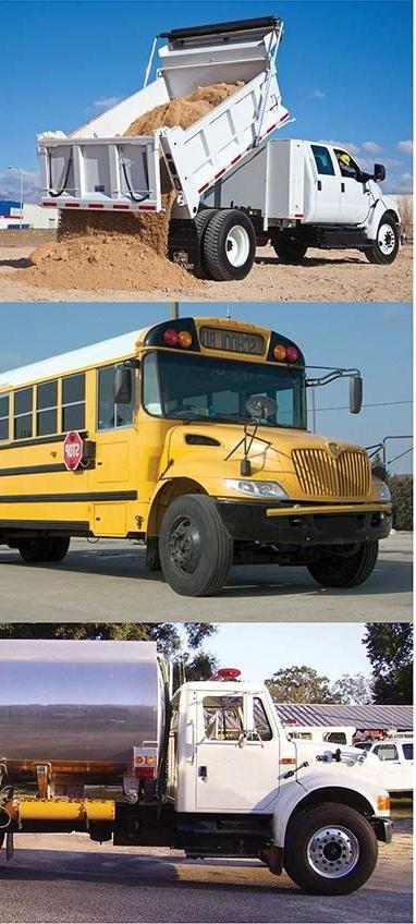 A dump truc, a school bus, and a tanker truck